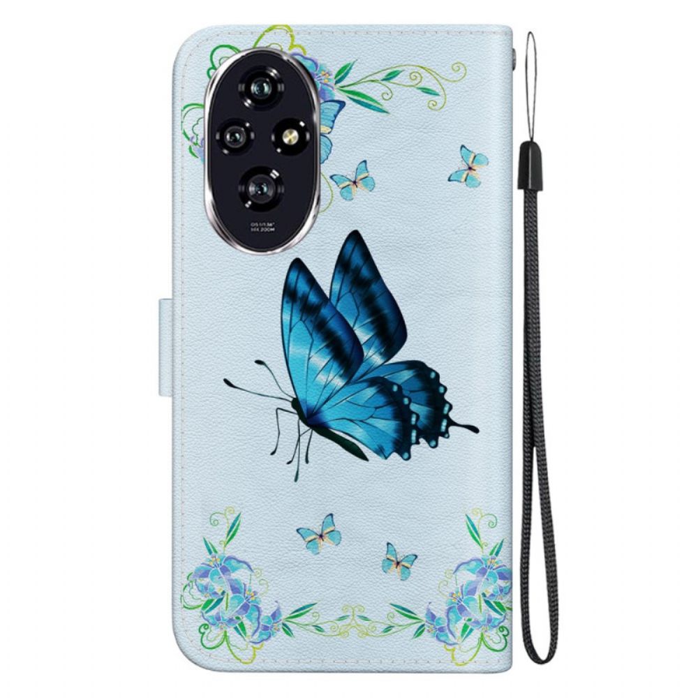 Folio-hoesje Honor 200 Telefoonhoesje Blauwe Vlinder En Bloemen Met Riempje