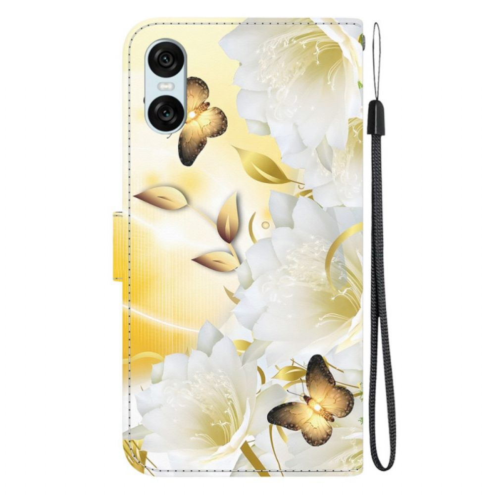 Folio-hoesje Sony Xperia 10 Vi Telefoonhoesje Gouden Vlinders En Witte Bloemen Met Riem