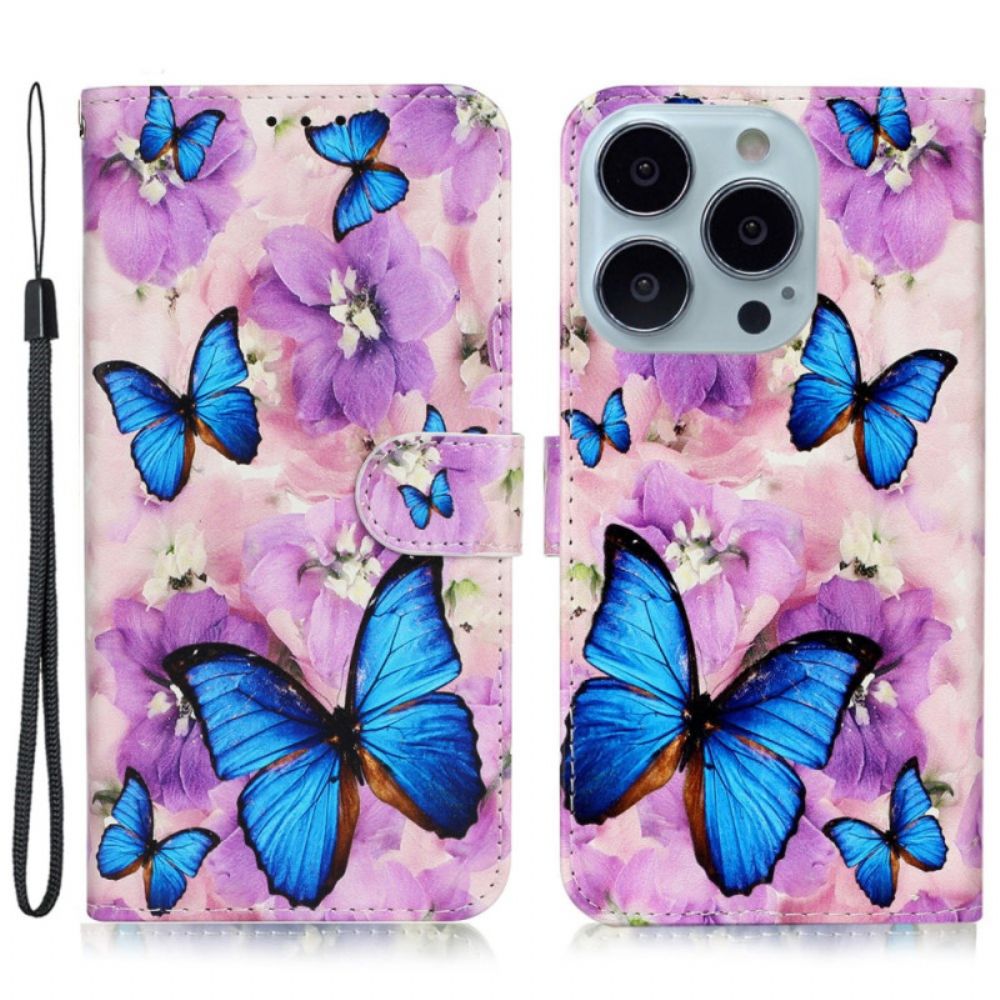 Folio-hoesje iPhone 16 Pro Max Vlinders En Paarse Bloemen Met Riempje