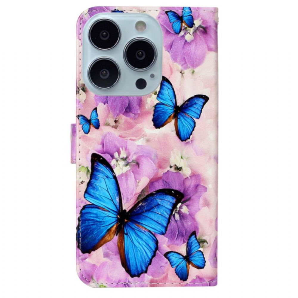 Folio-hoesje iPhone 16 Pro Max Vlinders En Paarse Bloemen Met Riempje