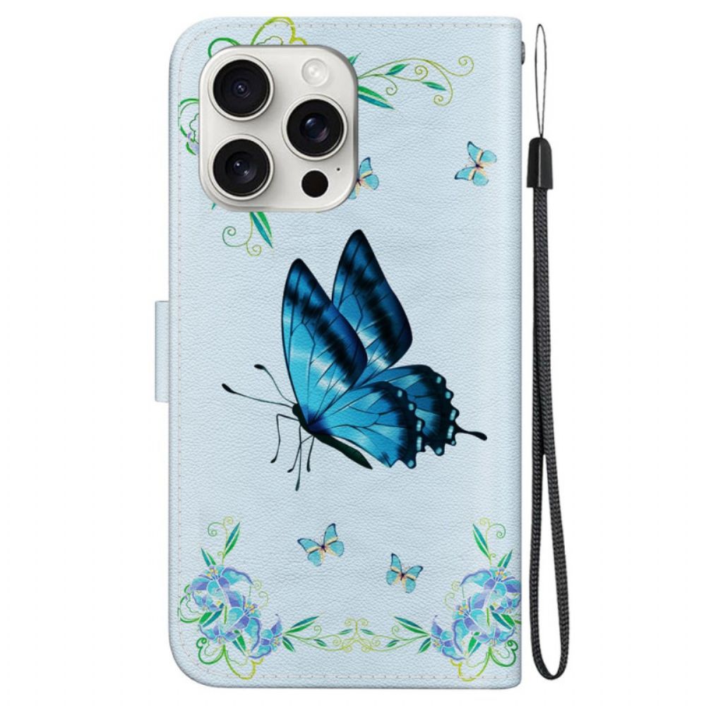 Leren Hoesje iPhone 16 Pro Max Blauwe Vlinder En Bloemen Met Riempje Bescherming Hoesje