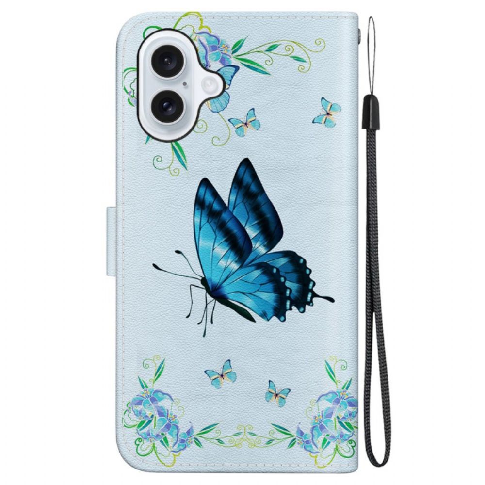 Leren Hoesje iPhone 16 Blauwe Vlinder En Bloemen Met Riempje Bescherming Hoesje